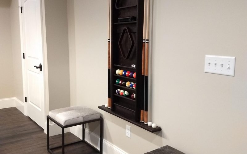 pool rack on wall in finished basement