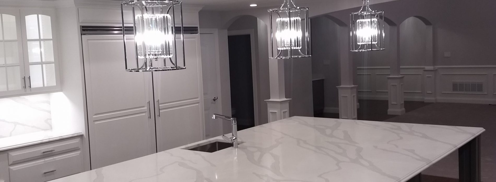 white marble counter top of a large kitchen island