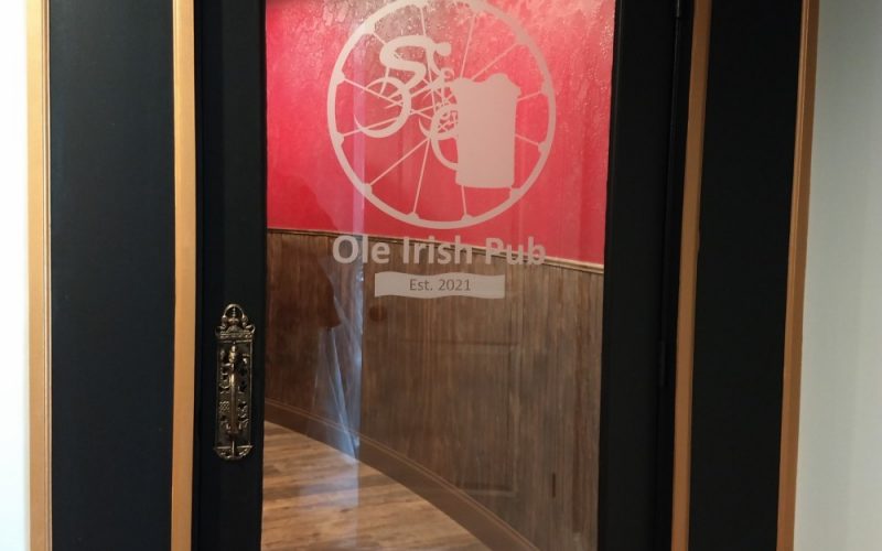 glass door to the spoke and ale old irish pub